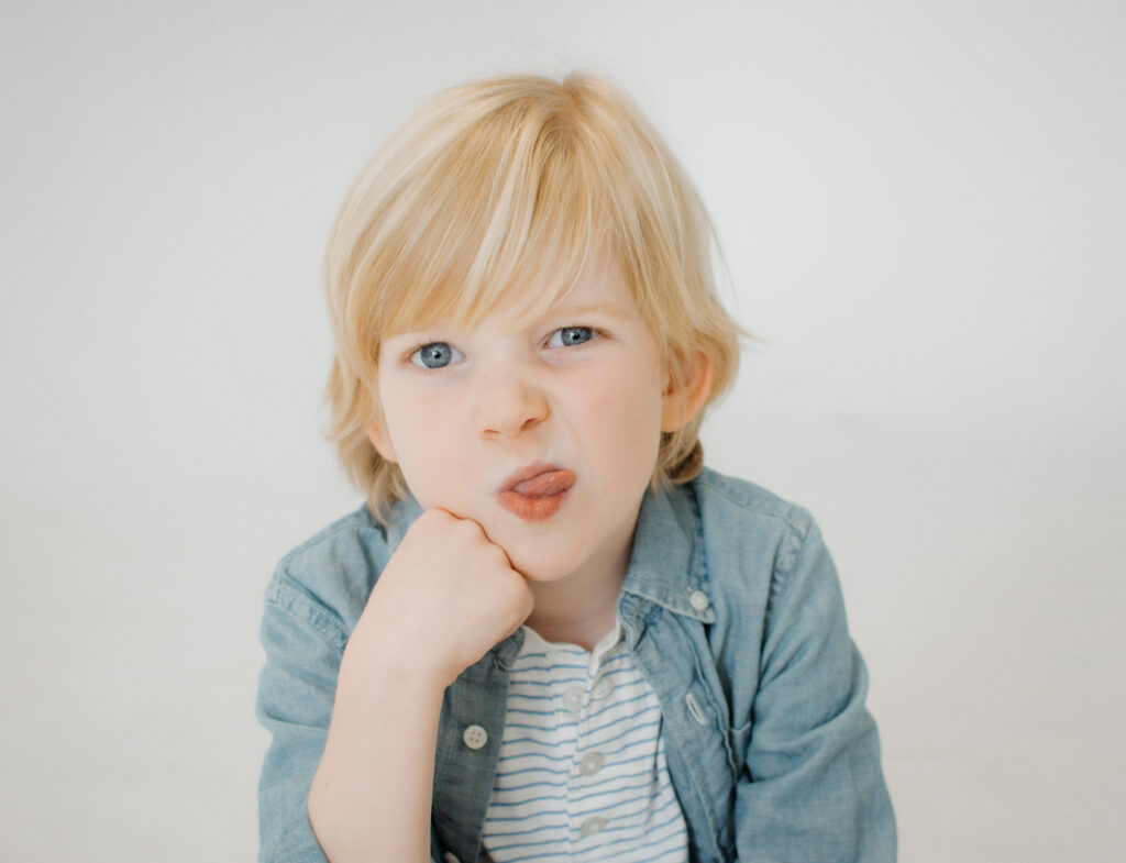 Atlanta kids portrait of little boy with his tongue sticking out