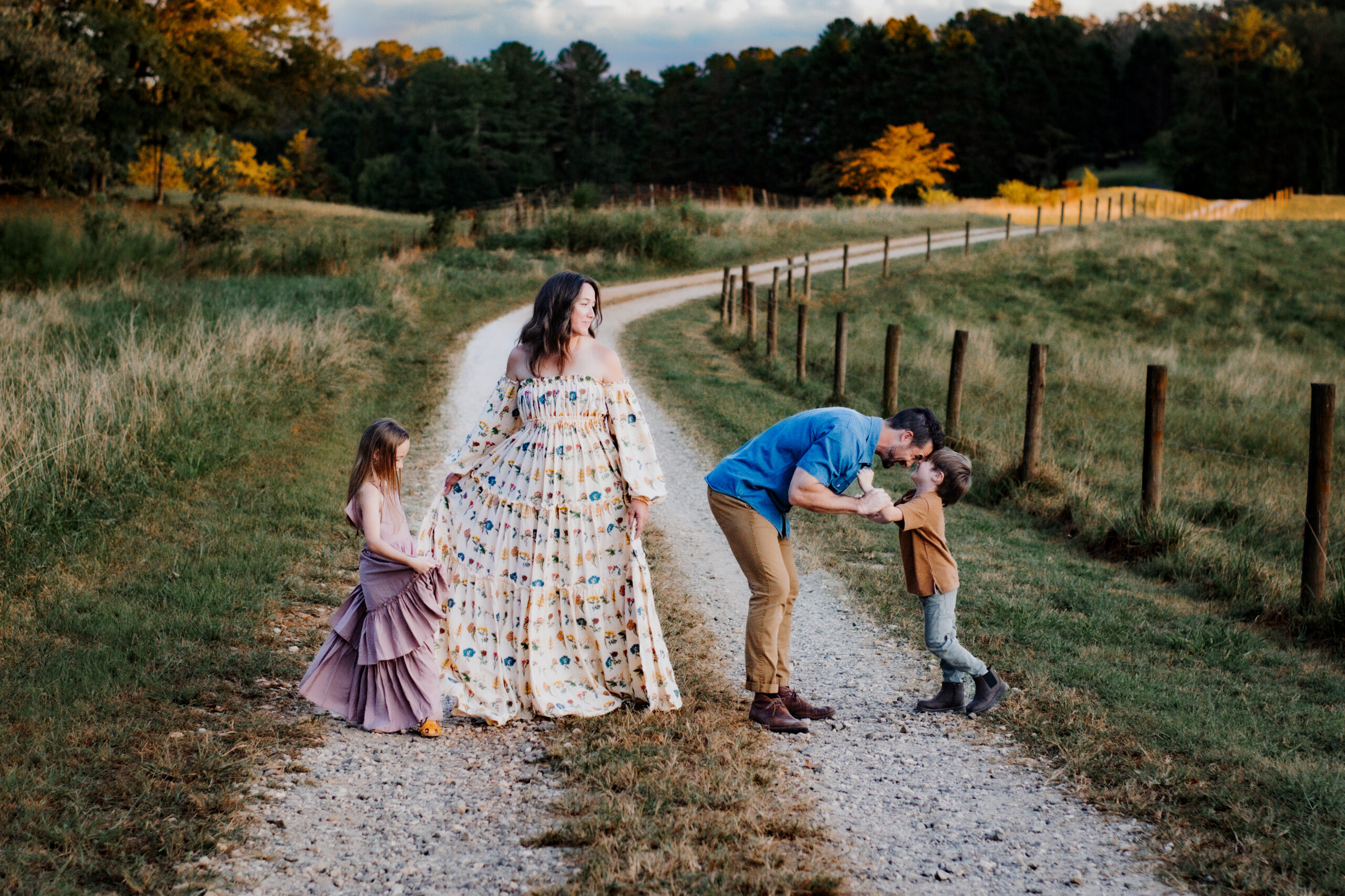 Family on gravel road dressed for photos