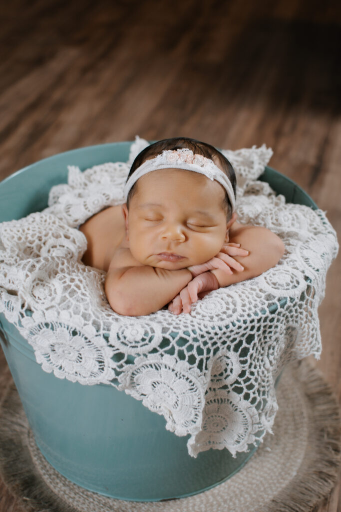 baby sleeps in bucket during Grayson newborn session