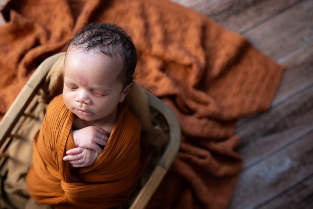 burnt orange set for newborn photo session in atlanta