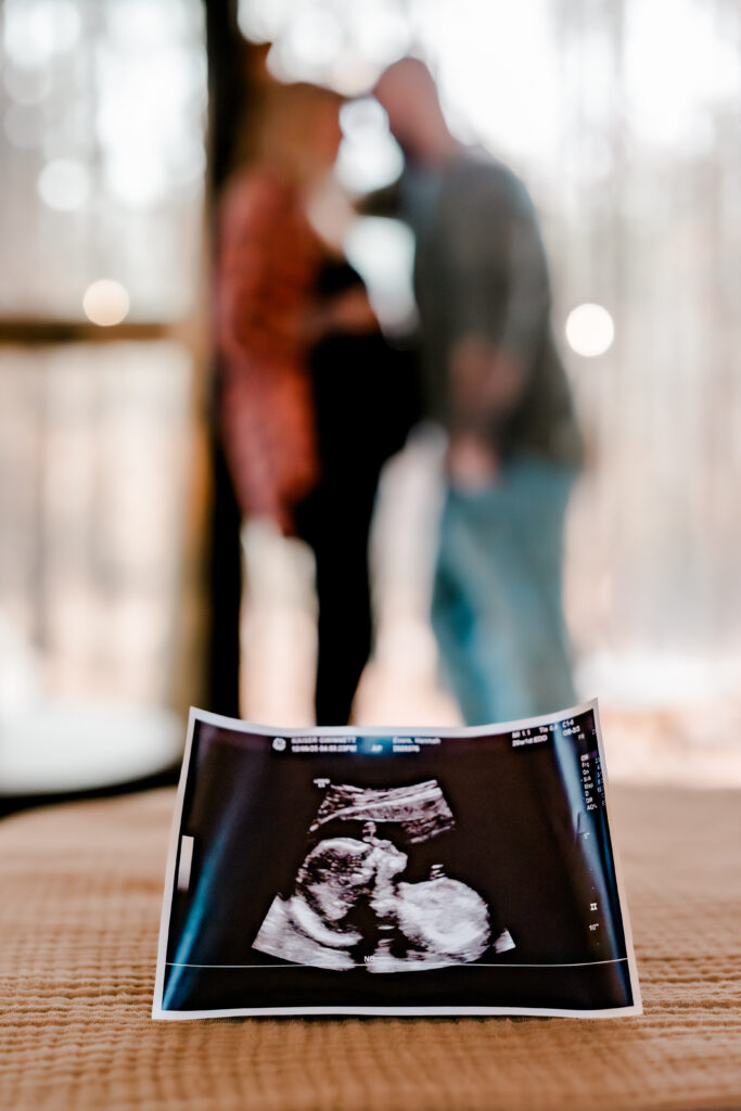 Sonogram in the foreground of a maternity photo
