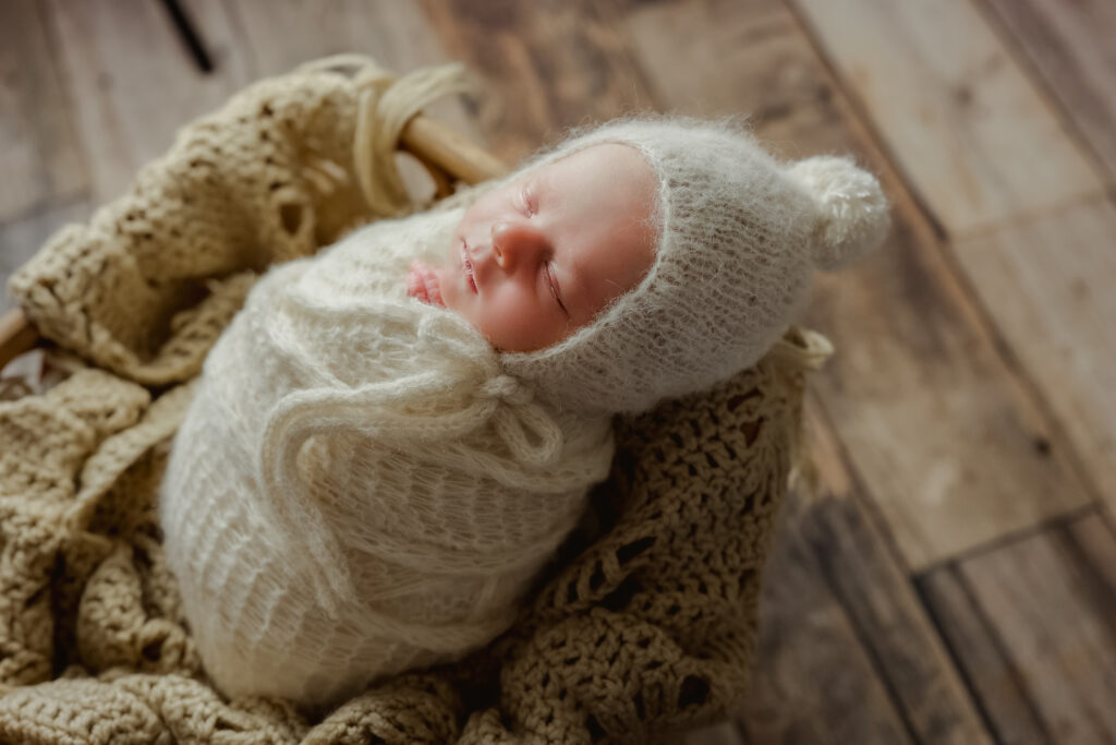 Side angle of posed newborn during in-home session