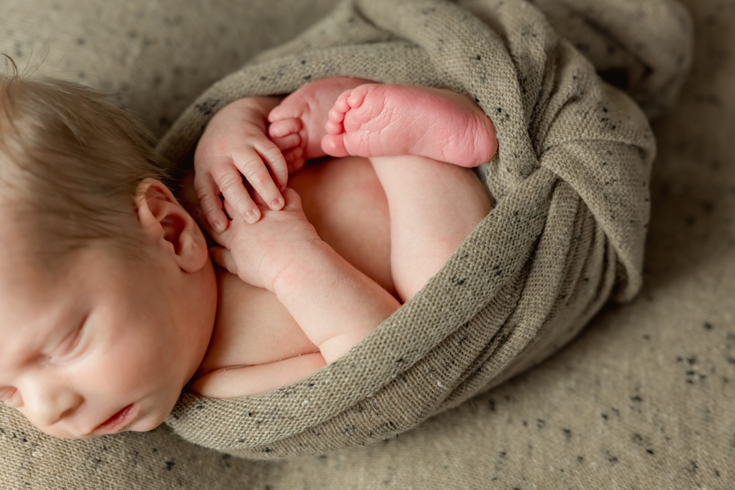 close up of newborn hands and feet