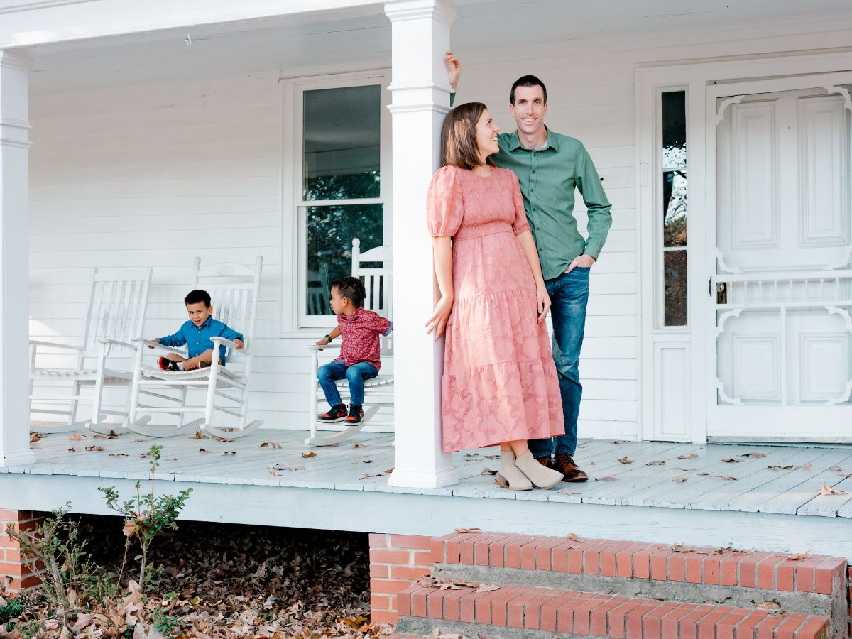 Image of Atlanta family on front porch at McDaniel Farm Park